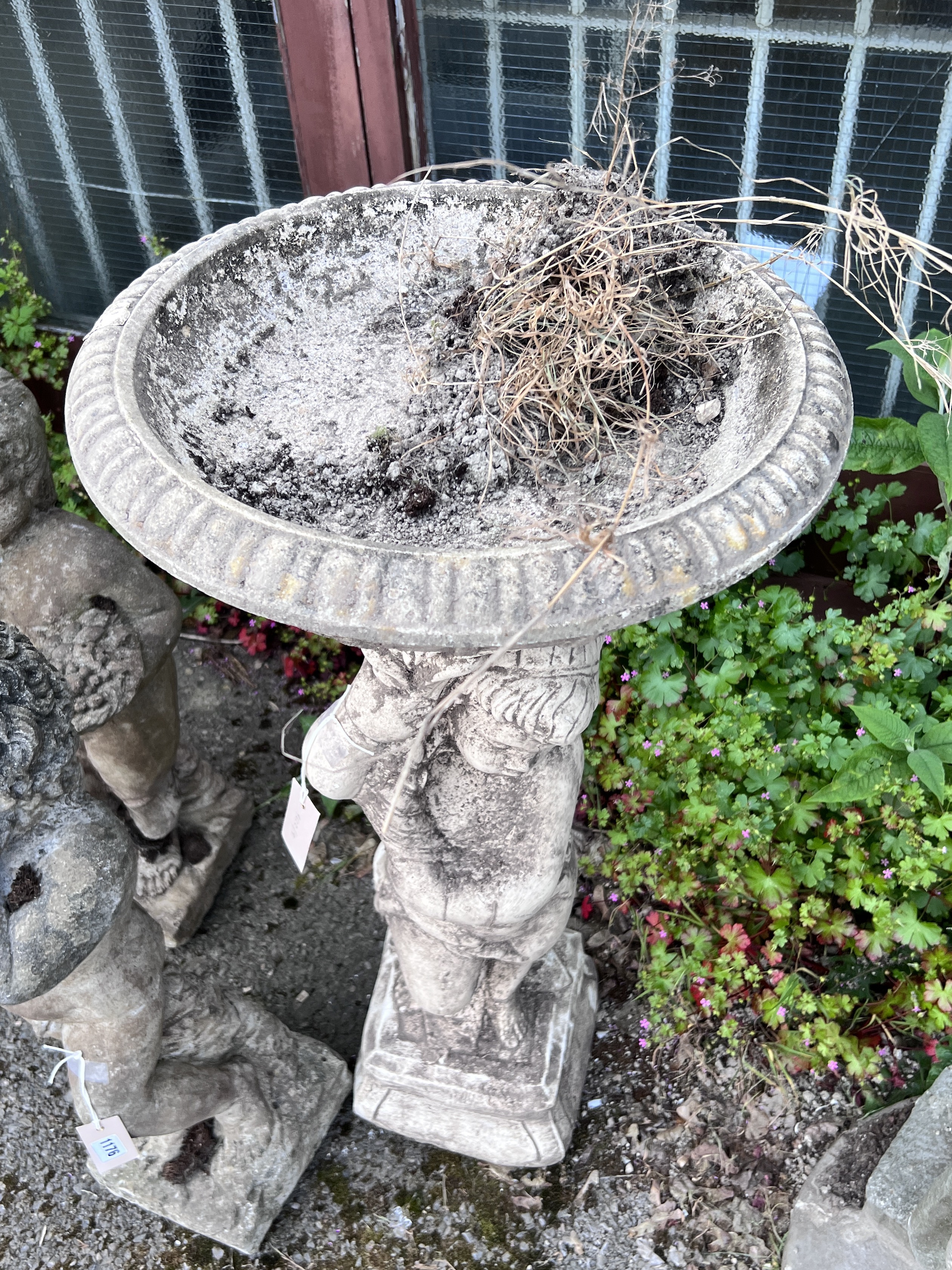 A circular cast stone cherub fountain bird bath, height 92cm